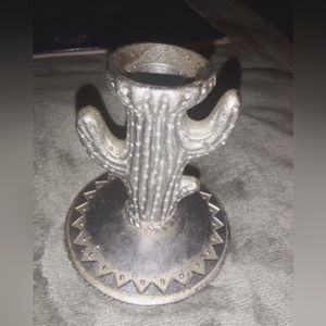 A cute metal cactus candle holder. 3 1/2 inch high 3 inch wide at bottom.